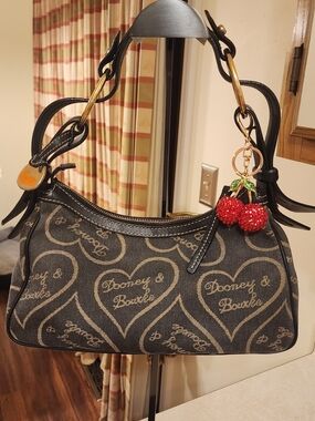 vintage Dooney & Bourke heart denim shoulder bag featuring black leather trim an
